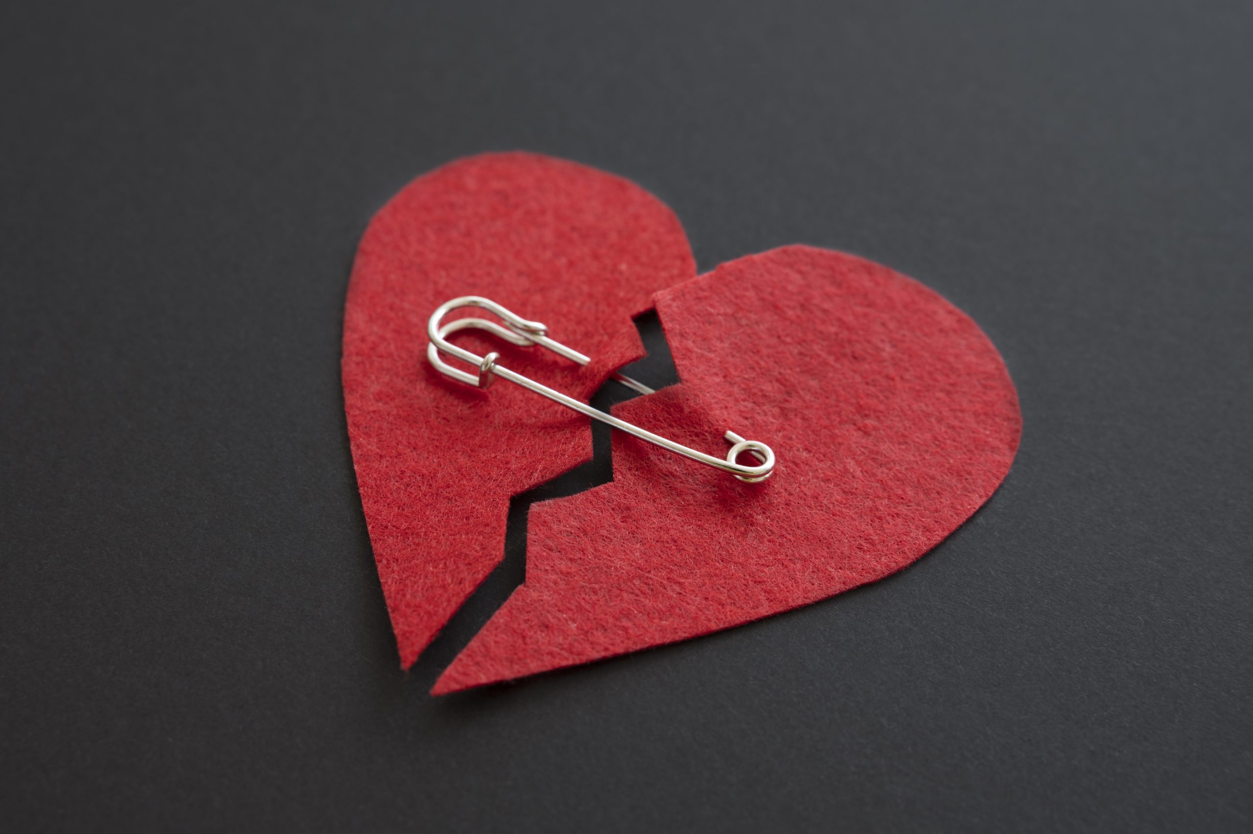 high-angle-broken-heart-with-safety-pin